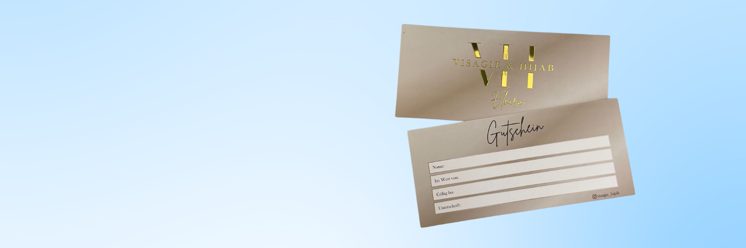 Bild von 2 Gutscheine mit Goldlack auf hellblauem Hintergrund. 